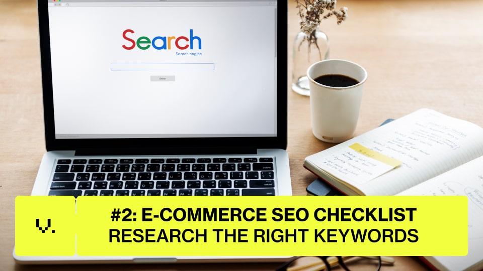 A laptop displaying a search engine homepage sits on a desk next to coffee, glasses, and a notebook. A yellow banner reads "#2: E-COMMERCE SEO CHECKLIST—RESEARCH THE RIGHT KEYWORDS for your online store. | Ven Agency